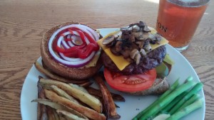 The taste of summer - a burger with all the fixings piled high on a toasted whole wheat bun