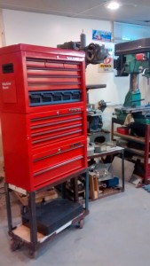 Rolling tool cabinet in the shop on its welded base