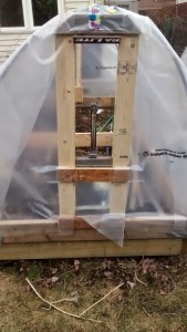 Vent frame in place with hoop house plastic attached