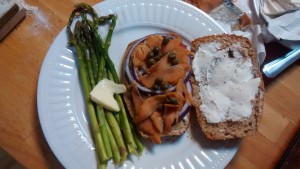 Brunch - fresh whole wheat bagels with smoked salmon accompanied by asparagus