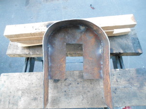 Sheet steel bent and welded to form shroud for the homestead grain mill