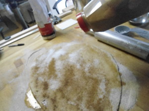 Bread Dough rolled out, oiled and spinkled with sugar and cinnamon and ready to be rolled up