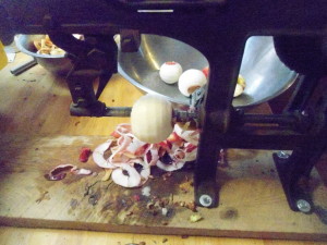 One second later the apple is peeled and the coring is nearly complete