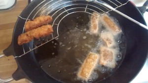 Homemade spring rolls frying