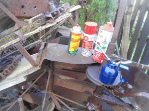 Homemade penetrating oil alongside commercial products and a can of white gas.