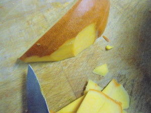 Cutting the rind from the pumpkin
